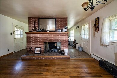 KITCHEN VIEW OF DOUBLE SIDED FIREPLACE ACCESSING L