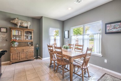 Bright informal dining area will accommodate a lar