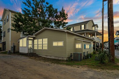 View of property exterior with a central air condition unit and entry steps