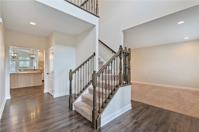 Bright two story entry (17x11) open to living room
