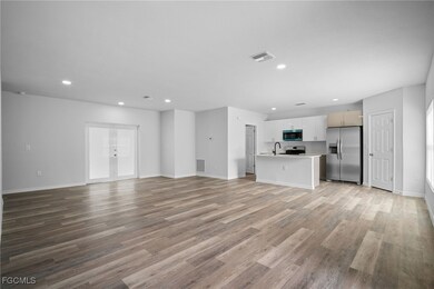 Unfurnished living room featuring recessed lighting and light wood-type flooring