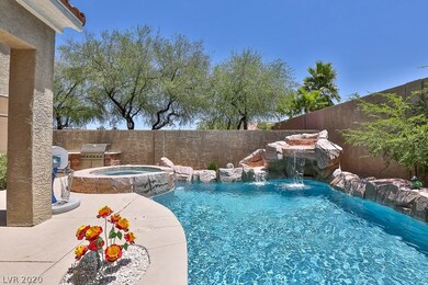 Sparkling In-ground Pool with Waterfall and Raised