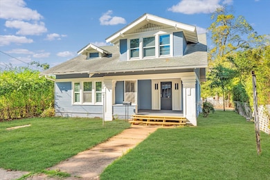 View of front facade with a front yard and a porch