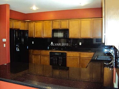 Property Photo. custom cabinets & black appliances