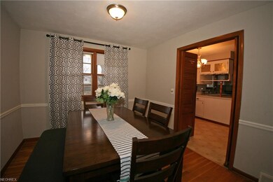 Formal Dining room with hardwood flooring and chai