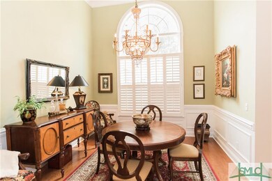 Formal dining room with extensive molding and soar