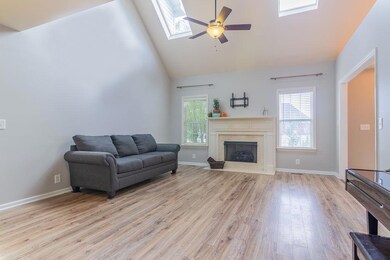 The great room has been painted with a neutral  gray that everyone is using in new construction and existing homes too.  The fireplace is  the focal point and has the tv bracket in place for easy installing yours. New wood flooring in great room too.
