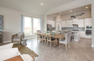 **Home is Under Construction. The photo shown here is of a completed home that has the same floor plan and similar elevation. Options and color selections may vary.**