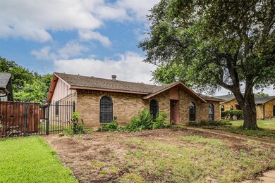 Single story home featuring a front yard