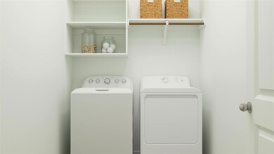 Washroom with laundry area and washer and clothes 