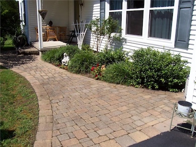 Very welcoming paver walkway at front entry.