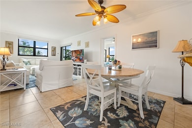 Dining space with light tile patterned flooring, o
