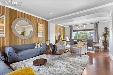 Living room featuring dark wood-type flooring, cro