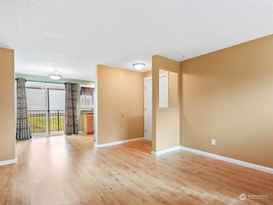 Living Room, Front Door, Dining Room w/ Sliding Door to Patio/Deck w/ Storage