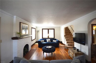 Another view of the living room and the stairway t