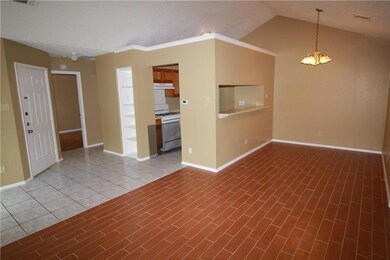 Unfurnished room with a chandelier and lofted cei