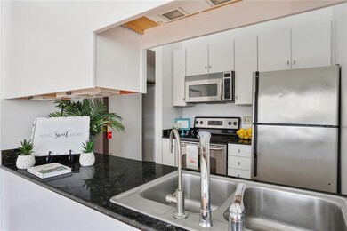 Lovely open kitchen with granite and stainless