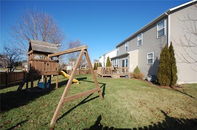 Fully fenced backyard with deck deck and playlet