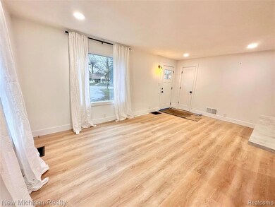 Entryway with recessed lighting and light wood-style flooring