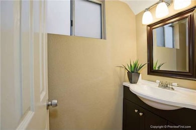 The Half Bathroom, Located Downstairs Off Of The L
