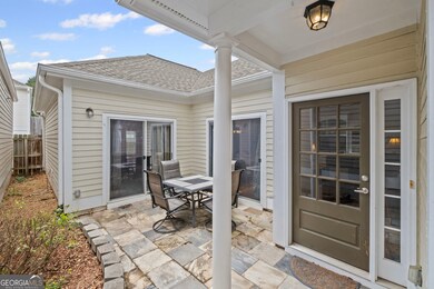 This property has a gated courtyard that leads to the front door.