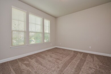 Behind the French doors you will find the private front study; this room functions well as a home office, formal living room, or a guest bedroom 
