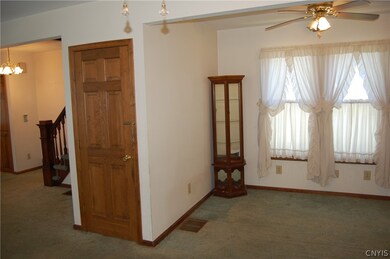 Living and dining area are open with tons of natur