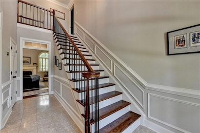 Staircase with wooden steps and understated wrough