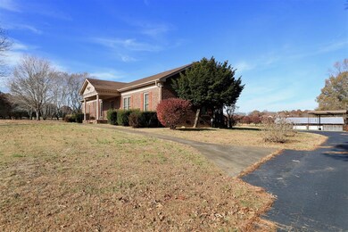 This all brick home sits on approximately 4 acres.