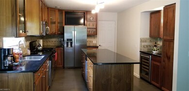 walnut cabinets with soft close and glass doors, g