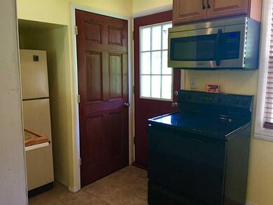 Kitchen. Door leading to the beautiful outdoor yar
