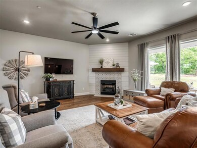 Living area featuring a ceiling fan, recessed ligh
