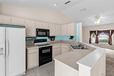 Kitchen w/ Vaulted Ceiling & Tile Floor