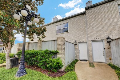 Lighted and lushly landscaped entrance to 280 Wilc