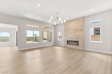 Unfurnished living room with baseboards, a notable