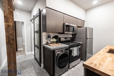 Kitchen featuring stainless steel appliances, wash