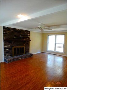 Spacious Den with hardwood floors throughout