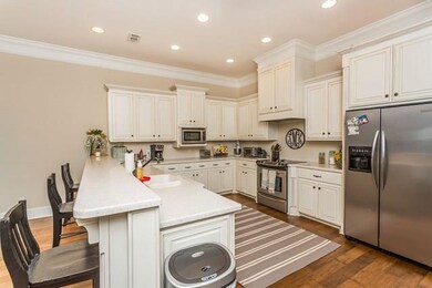 Long breakfast bar overlooking kitchen.