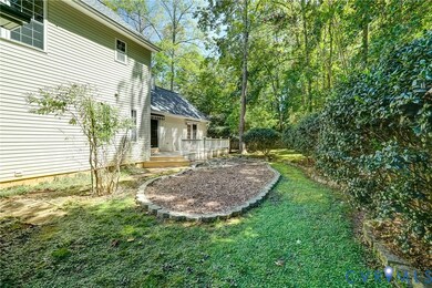 View of grassy yard with a wooden deck