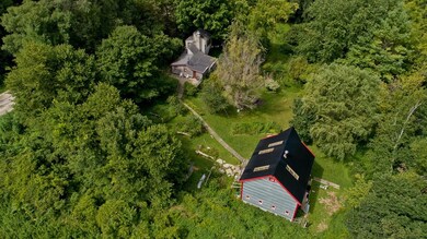 House in upper area and studio in lower portion of