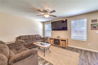 Living room with wood finished floors and a ceilin