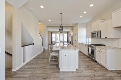 2nd floor Kitchen facing island from dining room a