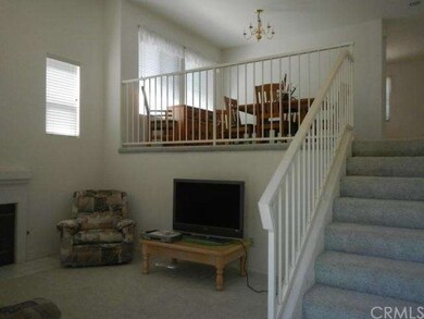 Split level living room, leading up to dining room