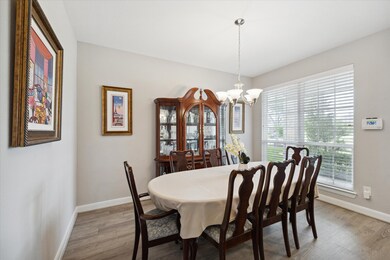 Light and bright, this spacious dining room easily seats a party of 8 or more.