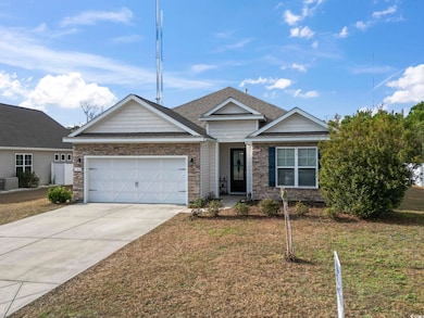 View of front of property featuring a garage and a