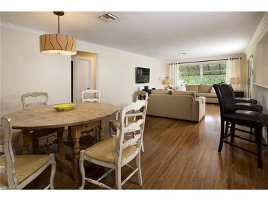 Crown molding and hard wood floors add warmth to t