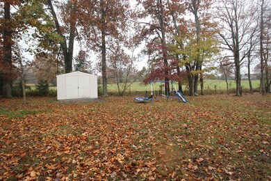 Back yard has a great view of a farm