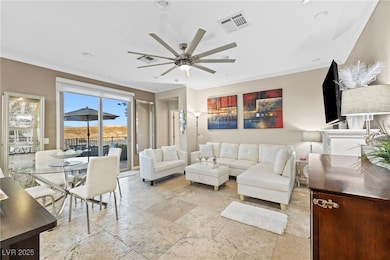 Living room with fireplace and travertine floors