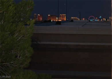 Patio at twilight with a view of city lights