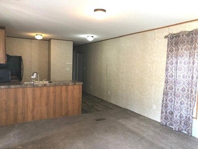 living area to kitchen